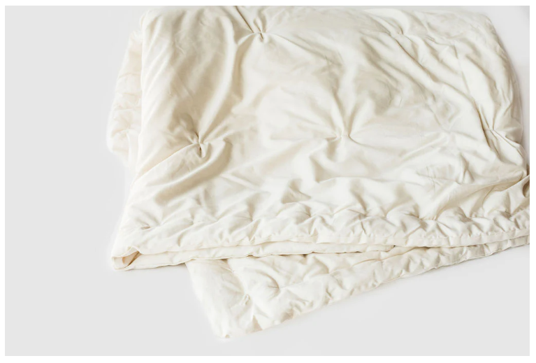 Designed and handcrafted for comfort, warmth and coziness, our certified organic quilted comforters are made from GOTS-certified wool encased in GOTS-certified organic cotton sateen. Hand-tufted and stitched around the perimeter so the wool batting stays in place. Now with corner ties for securing into your duvet cover. These comforters naturally regulate body temperature, ensuring a restful sleep in any season. We offer three basic weights
