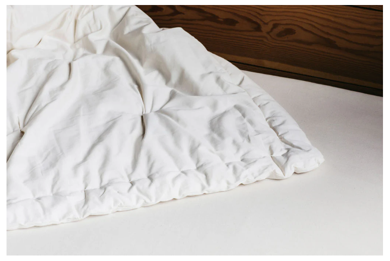 Designed and handcrafted for comfort, warmth and coziness, our certified organic quilted comforters are made from GOTS-certified wool encased in GOTS-certified organic cotton sateen. Hand-tufted and stitched around the perimeter so the wool batting stays in place. Now with corner ties for securing into your duvet cover. These comforters naturally regulate body temperature, ensuring a restful sleep in any season. We offer three basic weights