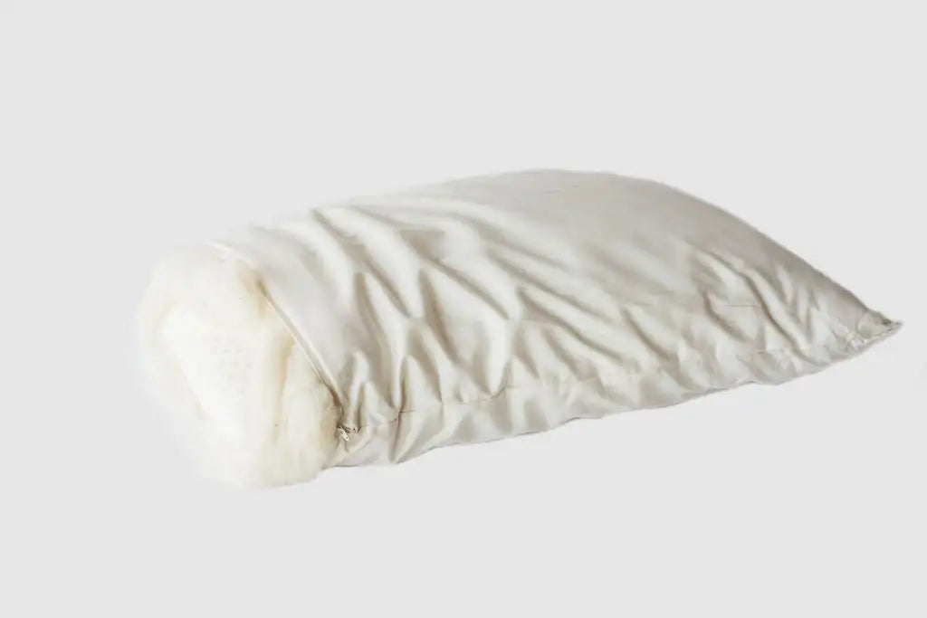 A 100% natural Dunlop latex core cocooned in a breathable swath of soft, domestically sourced Premium Eco Wool, all tucked inside an organic cotton sateen zippered cover.
This combination creates a thick and luxurious pillow that's great for side and back sleepers and provides excellent support when sitting up in bed to read or work. Additional covers available for purchase.