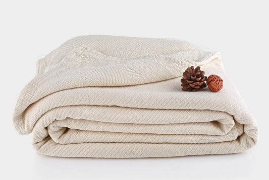 Indulge in the comforting embrace of the Organics And More Organic Cotton Chenille blanket. Meticulously crafted with hemmed edges and a charming herringbone pattern, this mid-weight blanket offers both texture and warmth. Made from GOTS certified organic cotton in a soothing ivory hue, it’s not only machine washable but also gets softer with every wash. Enjoy the durability and cozy comfort of this healthy alternative to conventional cotton blankets.
