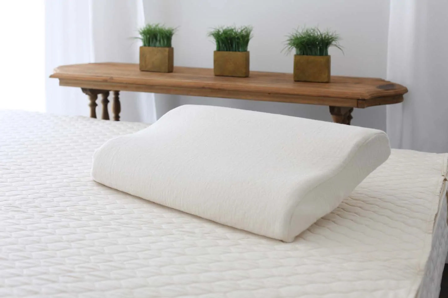 Gentle comfort for proper alignment.
Our contour pillow has an overall firm feel and provides excellent head and neck support. Medium Dunlop latex in an organic cotton casing