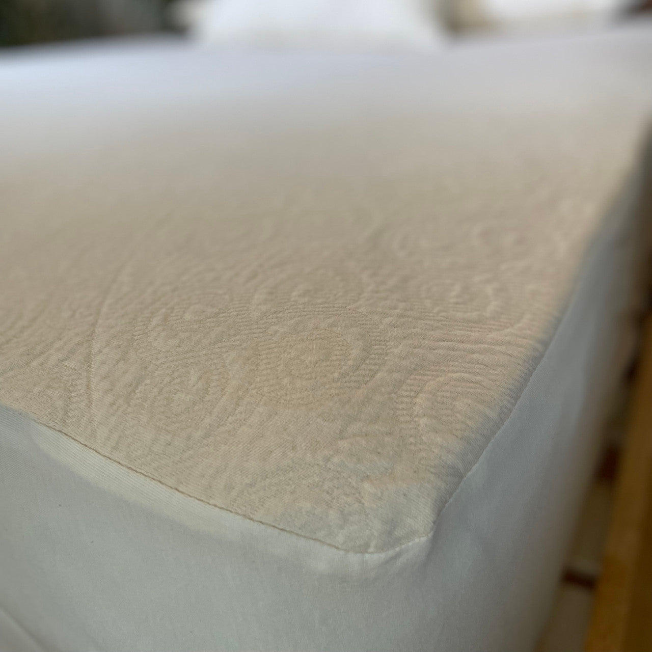 The Organic Cotton Knit protector is made using our soft double knit mattress ticking which uses 100% certified organic cotton fabric. It provides a layer of protection to any mattress that uses a stretch knit cover without minimizing the feel and pressure-point release. The organic knit protector is skirted with organic cotton knit jersey and features an 18" pocket. It will keep your mattress looking newer longer and is so soft and supple you won't want to put a sheet over it. Made in the USA using importe