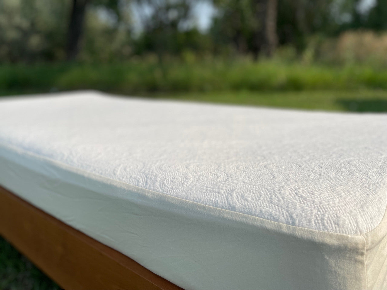 The Organic Cotton Knit protector is made using our soft double knit mattress ticking which uses 100% certified organic cotton fabric. It provides a layer of protection to any mattress that uses a stretch knit cover without minimizing the feel and pressure-point release. The organic knit protector is skirted with organic cotton knit jersey and features an 18" pocket. It will keep your mattress looking newer longer and is so soft and supple you won't want to put a sheet over it. Made in the USA using importe