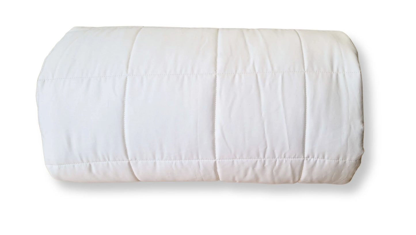 Soaring Heart's quilted organic cotton comforter is designed and crafted for our customers to achieve a restful sleep. The inner filling is made from our blend of certified organic cotton, and encased in a GOTS certified cotton fabric. The artisan quilting pattern keeps everything in place and makes this comforter extremely durable. This comforter is recommended for someone who sleeps cold, or prefers a more weighted comforter.