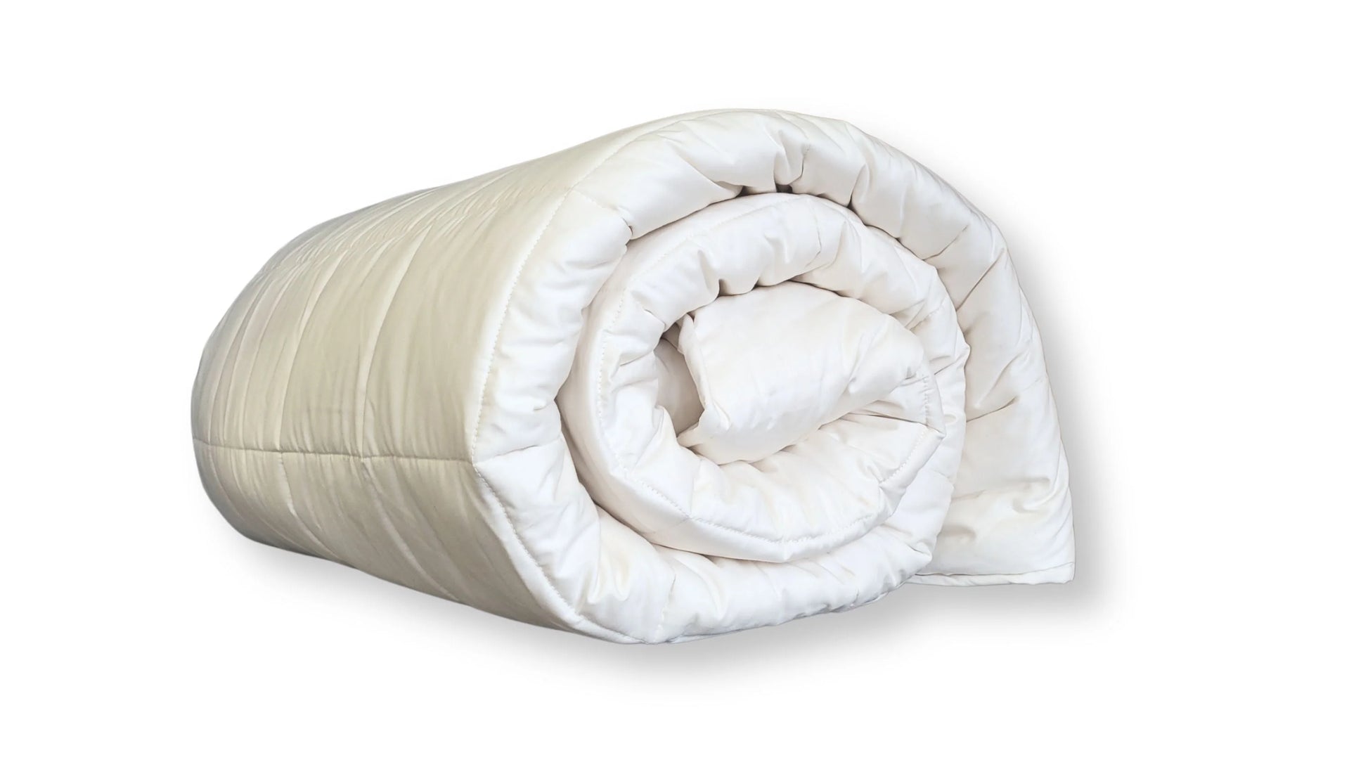 Soaring Heart's quilted organic cotton comforter is designed and crafted for our customers to achieve a restful sleep. The inner filling is made from our blend of certified organic cotton, and encased in a GOTS certified cotton fabric. The artisan quilting pattern keeps everything in place and makes this comforter extremely durable. This comforter is recommended for someone who sleeps cold, or prefers a more weighted comforter.