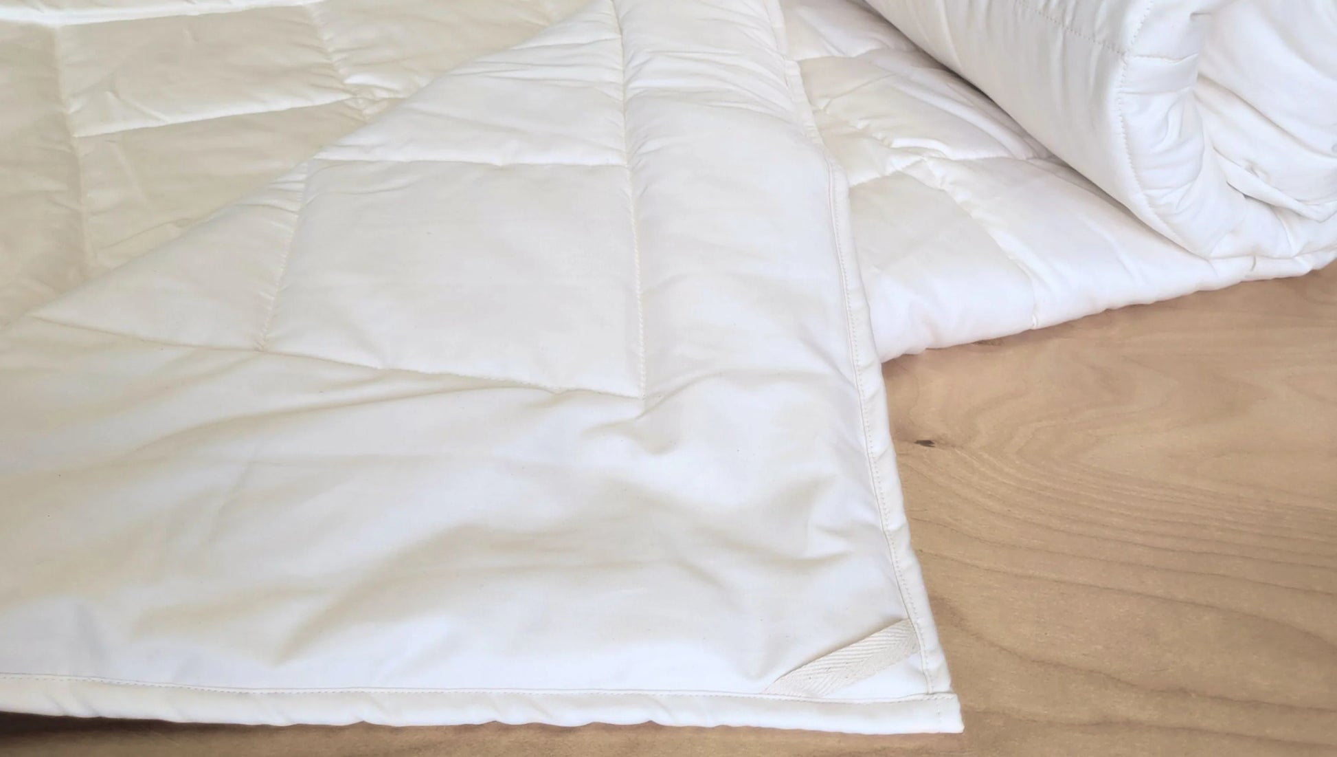 Soaring Heart's quilted organic cotton comforter is designed and crafted for our customers to achieve a restful sleep. The inner filling is made from our blend of certified organic cotton, and encased in a GOTS certified cotton fabric. The artisan quilting pattern keeps everything in place and makes this comforter extremely durable. This comforter is recommended for someone who sleeps cold, or prefers a more weighted comforter.