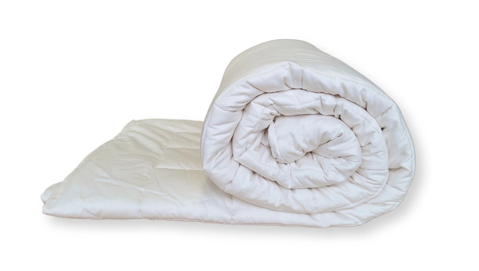 Soaring Heart's quilted organic cotton comforter is designed and crafted for our customers to achieve a restful sleep. The inner filling is made from our blend of certified organic cotton, and encased in a GOTS certified cotton fabric. The artisan quilting pattern keeps everything in place and makes this comforter extremely durable. This comforter is recommended for someone who sleeps cold, or prefers a more weighted comforter.