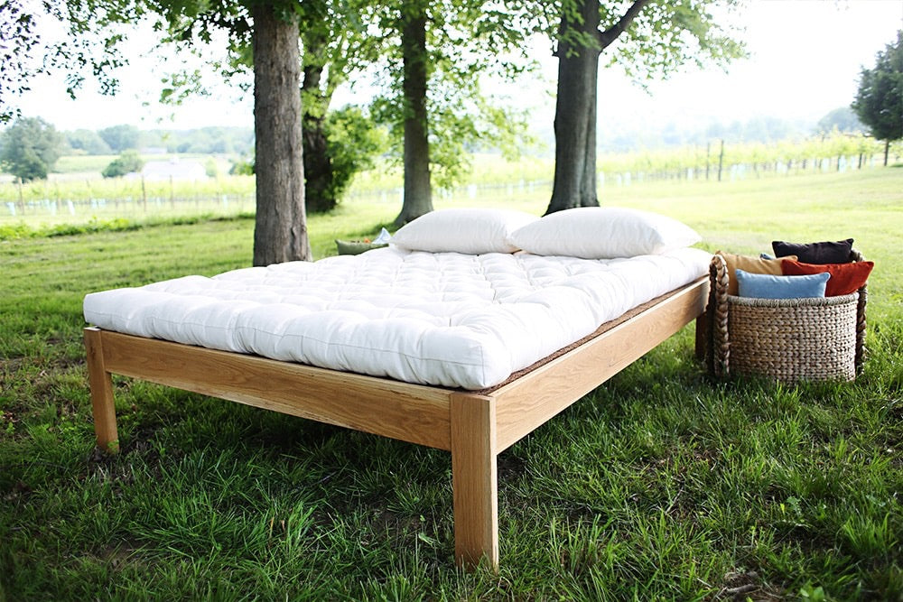 An organic wool mattress hand-made to order
The Pastoral is filled with organic wool batting inside a tufted organic cotton cover. It does not contain latex. The organic wool fiber is resilient, supportive, and promotes a cooler, drier sleep environment. The Pastoral is flexible enough to serve as a futon. Each is handmade and tufted with natural linen thread.