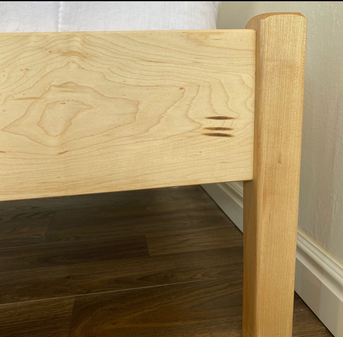 The Pecos bed is all about clean lines and a minimal look. Its price and functionality make it a top seller. Like all Nomad bed frames, the Pecos is made from either Red Oak or Hard Maple—both American-sourced hardwoods. Hidden hardware adds to its durability and sleek appearance. The Pecos stands 14″ tall, with slats positioned 12″ from the floor.