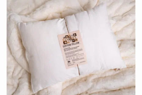 This pillow is made from certified organic cotton batting from the Texas Organic Growers Marketing Co-op. It is covered in organic cotton sateen. This is a great vegan pillow for those who do not want natural latex or wool. This is a firmer feeling pillow. Comes with a zipper so you can add or remove filling.
