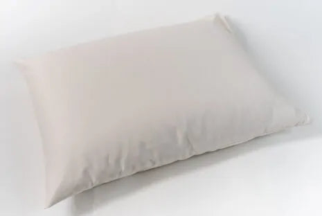 This pillow is made from certified organic wool and is covered in organic cotton sateen. Wool will not compress as much over time as an organic cotton pillow. Wicks away moisture on hot nights to help keep you cool and insulates on cool nights. Spot clean only. Comes with a zipper so you can add or remove filling.