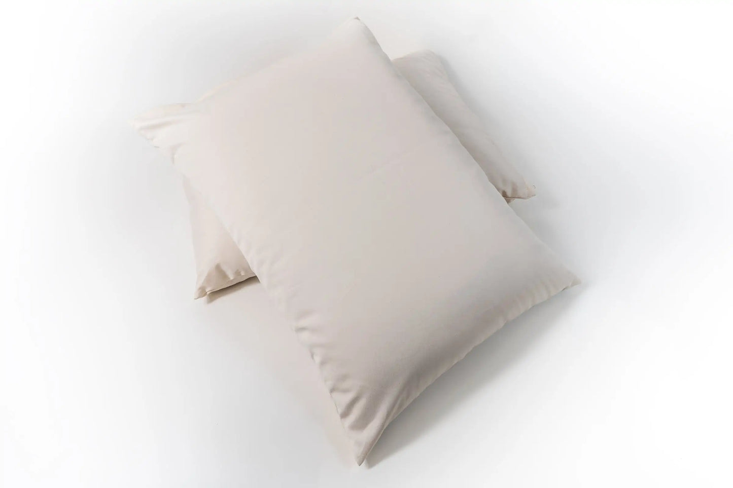 This pillow is made from small natural wool fluffs that stick to each other. You can move around the soft little balls of wool to shape it however it will best fit your neck and head. For example you can squish it around to create a thicker roll to support your neck and an indentation for your head or just a level surface. Comes with a zipper so you can add or remove filling. Can be ordered in three thicknesses, this is one of our most versatile pillows!