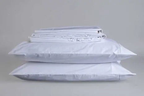 Immerse yourself in the pure, cooling comfort of our Sleep and Beyond Organic Sheets, spun from 100% GOTS certified organic cotton percale. Delight in the light, airy touch of our sheets, available in classic white or elegant natural ivory. Crafted with a 300-thread count for a perfect blend of breathability, crispness, and long-lasting durability, these sheets promise to transform your sleep experience.