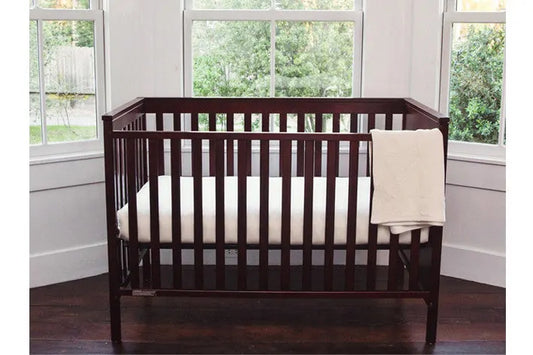 The Organic Sweetpea Crib Mattress by TFS Honest Sleep is an extra firm 6″ crib mattress. Made from organic dunlop latex, organic coconut coir, and organic wool surrounded by organic cotton fabric. It is constructed as a two sided crib mattress with a firmer side for infants (with the coconut coir side up, this is extra firm) and a softer side for toddlers (with the latex side up, this is considered firm).