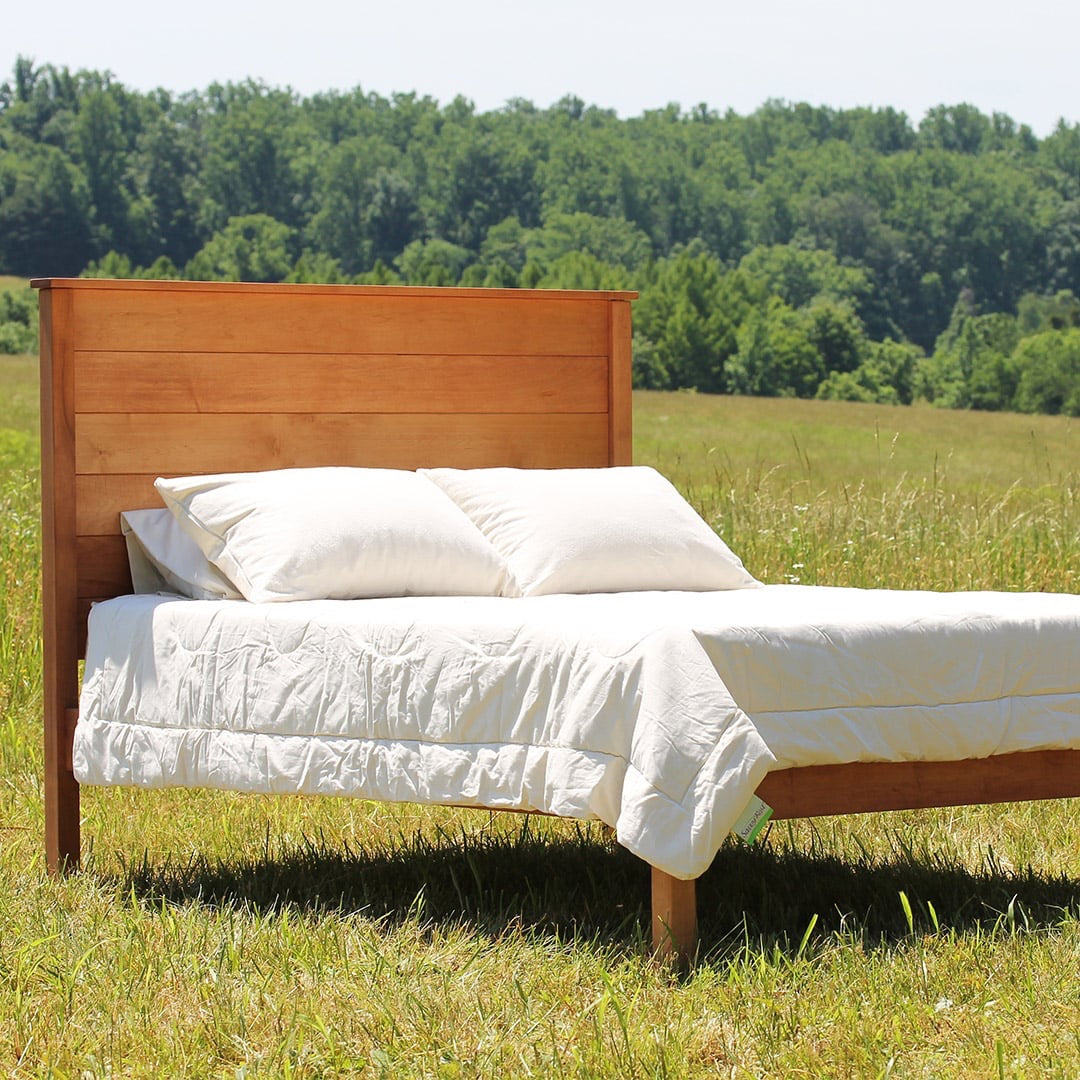 Hand-built in our Central Virginia woodshop, the Esmont natural platform bed marries traditional construction and clever design. Embrace your style by choosing between two headboard heights and either a solid or slatted look.
Made to last for generations, the Afton features closely-spaced poplar slats and solid steel, mortised-in corner brackets. Each corner has three tenons for optimal strength and durability. Simple assembly; no tools required.