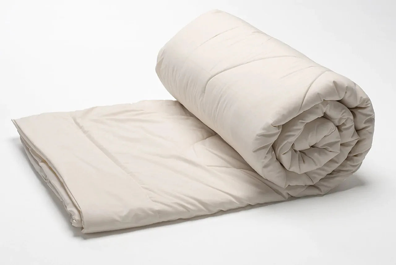 This lightweight comforter provides the perfect amount of comfort for sleeping in all seasons or for those who don't need much help keeping warm. The soft sateen cover features 100% GOTS Certified organic cotton quilted to our own American Dream Wool™ from local US farms. This comforter is made with super-washed wool, which allows it to be machine washed in cold without clumping or felting. For best results wash only if needed in cold on delicate and dry flat. You may also tumble dry on air dry or low heat.