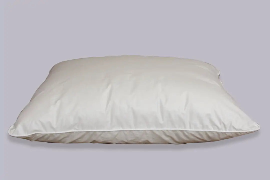 Crescent Moon Alpaca Wool Pillows are handcrafted and feature 100% natural, organically grown Alpaca wool from Canada for superior warmth and comfort. Alpaca wool is mixed with a small amount of sheeps wool to create a fluffy loft.   Encased in a lusciously soft 260 thread count organic cotton and finished with piped edges.