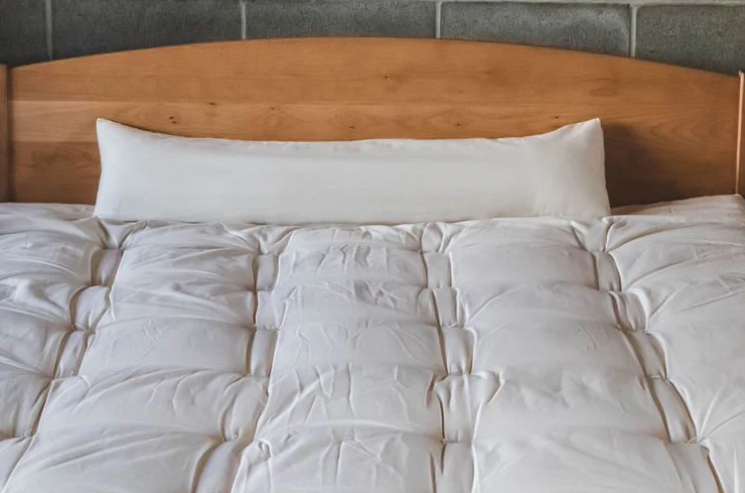 For side sleepers, hugging a body pillow between your legs and arms can provide excellent support and comfort. Utilizing a body pillow can help align your spine, hips, and neck in a neutral position, allowing for a more restful night's sleep and a more comfortable awakening.

Also great for moms-to-be! Pregnancy creates increasing skeletal stress and muscle imbalance as the body works to accommodate the growing weight of the baby. The neutral spine position provided by a body pillow allows the body to relax