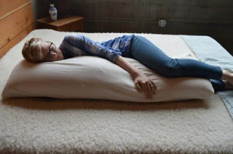 For side sleepers, hugging a body pillow between your legs and arms can provide excellent support and comfort. Utilizing a body pillow can help align your spine, hips, and neck in a neutral position, allowing for a more restful night's sleep and a more comfortable awakening.

Also great for moms-to-be! Pregnancy creates increasing skeletal stress and muscle imbalance as the body works to accommodate the growing weight of the baby. The neutral spine position provided by a body pillow allows the body to relax