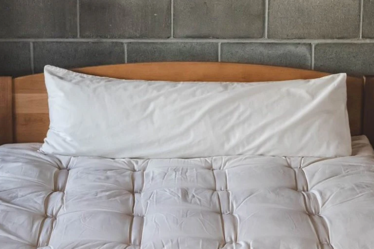 For side sleepers, hugging a body pillow between your legs and arms can provide excellent support and comfort. Utilizing a body pillow can help align your spine, hips, and neck in a neutral position, allowing for a more restful night's sleep and a more comfortable awakening.

Also great for moms-to-be! Pregnancy creates increasing skeletal stress and muscle imbalance as the body works to accommodate the growing weight of the baby. The neutral spine position provided by a body pillow allows the body to relax