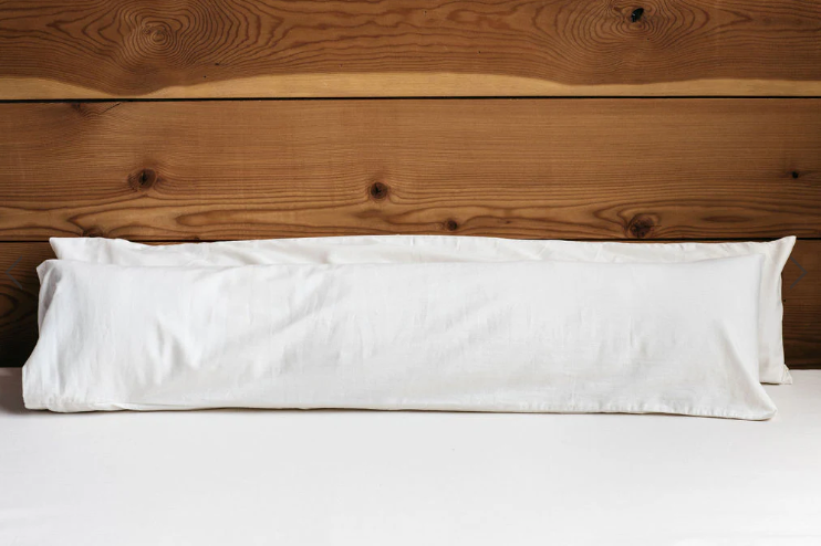 For side sleepers, hugging a body pillow between your legs and arms can provide excellent support and comfort. Utilizing a body pillow can help align your spine, hips, and neck in a neutral position, allowing for a more restful night's sleep and a more comfortable awakening.

Also great for moms-to-be! Pregnancy creates increasing skeletal stress and muscle imbalance as the body works to accommodate the growing weight of the baby. The neutral spine position provided by a body pillow allows the body to relax