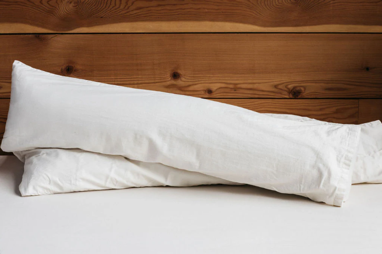 For side sleepers, hugging a body pillow between your legs and arms can provide excellent support and comfort. Utilizing a body pillow can help align your spine, hips, and neck in a neutral position, allowing for a more restful night's sleep and a more comfortable awakening.

Also great for moms-to-be! Pregnancy creates increasing skeletal stress and muscle imbalance as the body works to accommodate the growing weight of the baby. The neutral spine position provided by a body pillow allows the body to relax