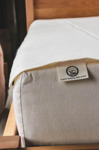 Our 100% natural moisture barrier is created without fillers or additives, making this woven wool textile the perfect chemical-free solution for mattress and topper protection.

The wool is tightly woven and slightly felted, resulting in a naturally water repellent fabric that's a healthy and eco-friendly alternative to synthetic products. The great thing is that it gets even more water repellant as it's washed!