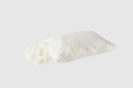 Tailor to your exact comfort preference. All the benefits of wool, plus soft, squishable support similar to a down-feather product. Our most versatile pillow, tiny puffs of wool encased in a zippered case of organic cotton sateen can be adjusted for maximum comfort.

Wool puffs have more substance than down, meaning they can take a shape and hold it. Easily add or remove puffs to fine tune your exact comfort level. Extra puffs available in 3- and 6-oz bags.