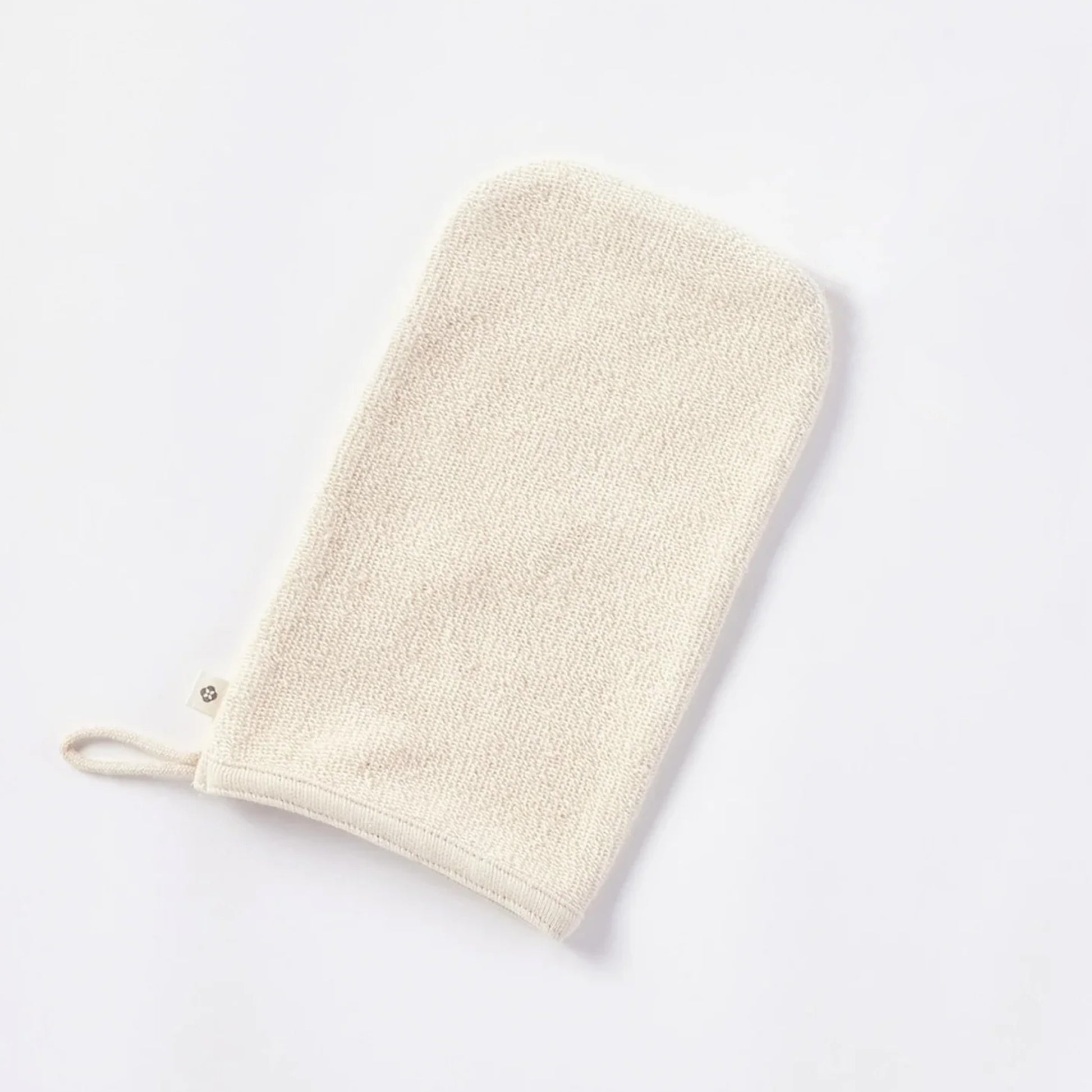 Complete your natural bath ritual with the Bare Organic Bath Mitt. Crafted with 100% organic cotton French terry, the smooth side gently pampers your skin, while the looped side offers light exfoliation. The thoughtful design includes rounded corners for a comfortable fit and a loop for easy hang drying. Fair Trade Certified and undyed to maintain its purest form, the Bare Organic Bath Mitt is a sustainable choice for your self care and the planet. 9"x5"
