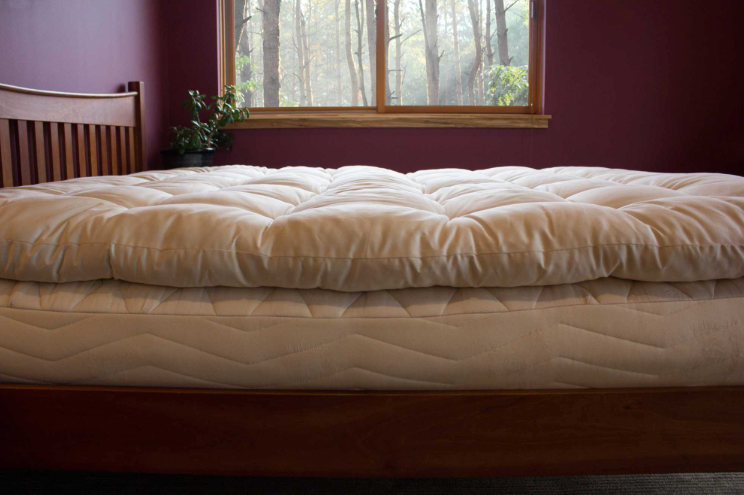 Encased in GOTS-certified organic cotton sateen and filled with GOTS-certified wool, our quilted toppers are designed to sit atop your existing mattress. With organic wool sustainably sourced from New Zealand, these toppers provide a comfortable, breathable sleep surface that naturally regulates body temperature. Adding a topper allows you to fine-tune your sleep system to your comfort preference.