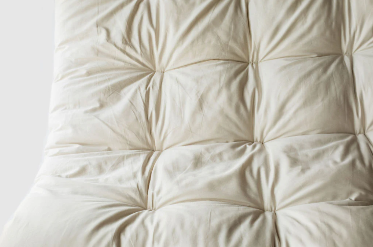 Encased in GOTS-certified organic cotton sateen and filled with GOTS-certified wool, our quilted toppers are designed to sit atop your existing mattress. With organic wool sustainably sourced from New Zealand, these toppers provide a comfortable, breathable sleep surface that naturally regulates body temperature. Adding a topper allows you to fine-tune your sleep system to your comfort preference.