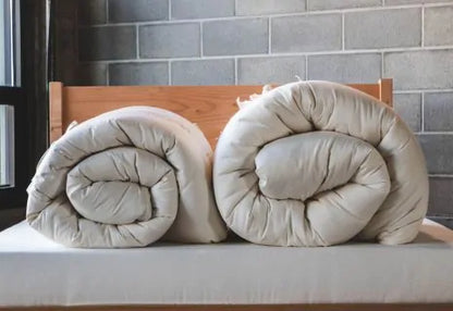 Encased in GOTS-certified organic cotton sateen and filled with GOTS-certified wool, our quilted toppers are designed to sit atop your existing mattress. With organic wool sustainably sourced from New Zealand, these toppers provide a comfortable, breathable sleep surface that naturally regulates body temperature. Adding a topper allows you to fine-tune your sleep system to your comfort preference.

Wool is naturally hypoallergenic, dust-mite resistant, anti-microbial and anti-bacterial, and inherently fire 