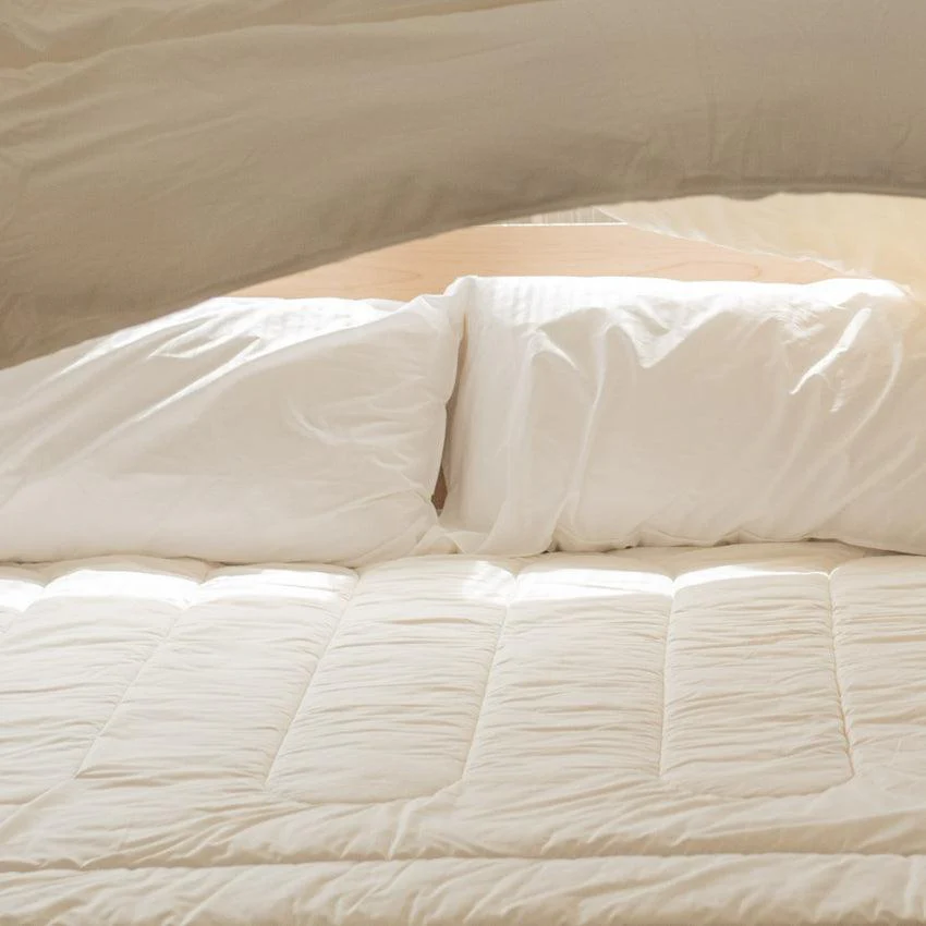 Our organic wool is complimented by our beautiful sateen organic cotton covers with a 260 thread count. The thread count not only complements the wool function but also allows airflow, and longevity and prevents felting. This soft silky cotton is GOTS Certified (Global Organic Textile Standards) and was grown and picked in Turkey.