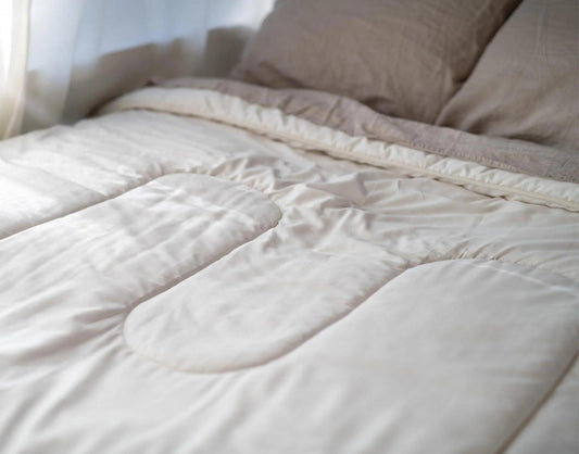 Our organic wool is complimented by our beautiful sateen organic cotton covers with a 260 thread count. The thread count not only complements the wool function but also allows airflow, and longevity and prevents felting. This soft silky cotton is GOTS Certified (Global Organic Textile Standards) and was grown and picked in Turkey.