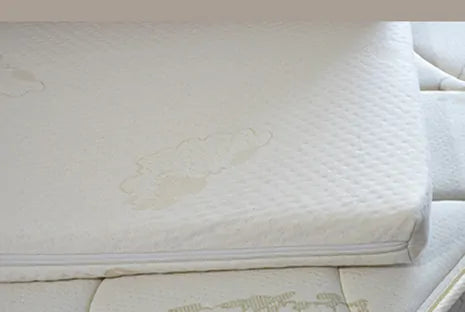 The Latex Topper is Stage 3 in our 3 Stage "Grow with Me" system for kids who've reached 85 lbs. or more. This topper is the perfect layer for pre-teens and teens' growing bodies. It offers pressure point relieving support and fits in between the wool topper and mattress. It is covered in the same Little Lamb certified organic cotton. We use only Soft 100% Botanical Dunlop latex for the 2" latex core. There is no wool in this product.