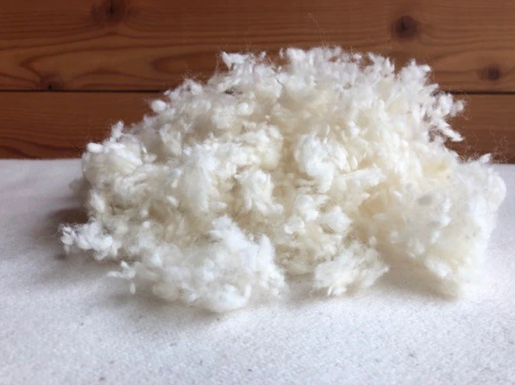 All the benefits of wool, plus soft, squishable support similar to a down-feather product. Our most versatile pillow, tiny puffs of wool encased in a zippered case of organic cotton sateen can be adjusted for maximum comfort.

Wool puffs have more substance than down, meaning they can take a shape and hold it. You can easily add or remove puffs to tailor this pillow to your growing child's support and comfort needs.