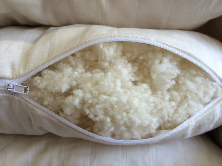 All the benefits of wool, plus soft, squishable support similar to a down-feather product. Our most versatile pillow, tiny puffs of wool encased in a zippered case of organic cotton sateen can be adjusted for maximum comfort.

Wool puffs have more substance than down, meaning they can take a shape and hold it. You can easily add or remove puffs to tailor this pillow to your growing child's support and comfort needs.
