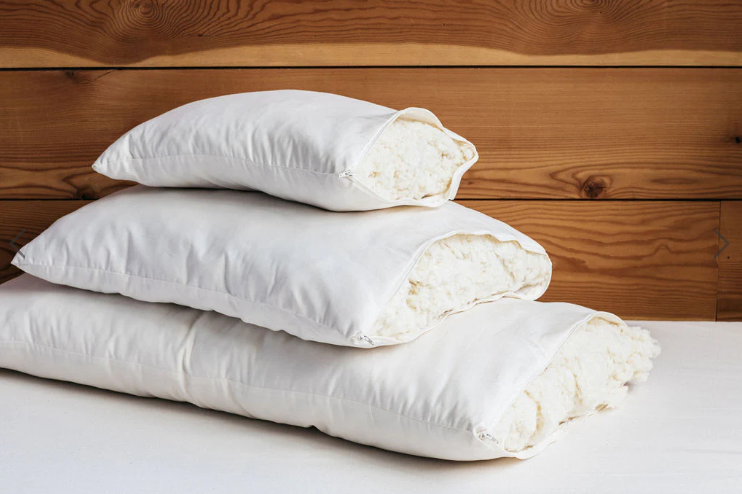 All the benefits of wool, plus soft, squishable support similar to a down-feather product. Our most versatile pillow, tiny puffs of wool encased in a zippered case of organic cotton sateen can be adjusted for maximum comfort.

Wool puffs have more substance than down, meaning they can take a shape and hold it. You can easily add or remove puffs to tailor this pillow to your growing child's support and comfort needs.