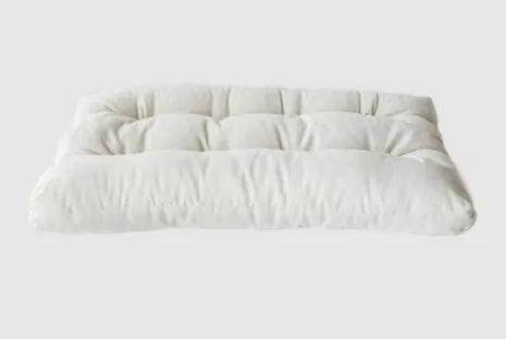 Developed in partnership with a chiropractic physician, this unique design allows your head to rest on a flat surface while your neck stays properly supported and in cervical alignment with your spine.

With a neck bolster along each long edge, one stuffed slightly more than the other, you can choose the exact amount of support you need. Made with Premium Eco Wool and 100% Organic Cotton, you also get the added benefits of temperature regulation and dust-mite resistance.
