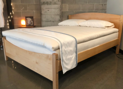 Elevate your sleep experience with our cushiony, all-natural mattress topper created from the purest latex wrapped in the finest wool. The best of both worlds in one luxurious package. The topper is made with 2" of GOLS-certified Dunlop latex, wrapped in our exceptional Premium Eco Wool and encased in GOTS-certified organic cotton sateen. The result is a 3"-deep topper that's super comfortable, durable, and free of chemicals and synthetic additives. The topper is rated an ILD of 25, or "soft."

This product