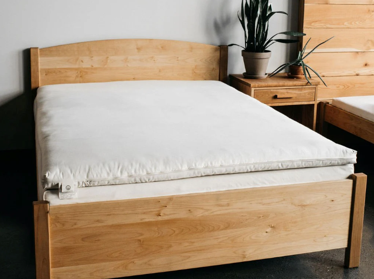 Elevate your sleep experience with our cushiony, all-natural mattress topper created from the purest latex wrapped in the finest wool. The best of both worlds in one luxurious package. The topper is made with 2" of GOLS-certified Dunlop latex, wrapped in our exceptional Premium Eco Wool and encased in GOTS-certified organic cotton sateen. The result is a 3"-deep topper that's super comfortable, durable, and free of chemicals and synthetic additives. The topper is rated an ILD of 25, or "soft."

This product