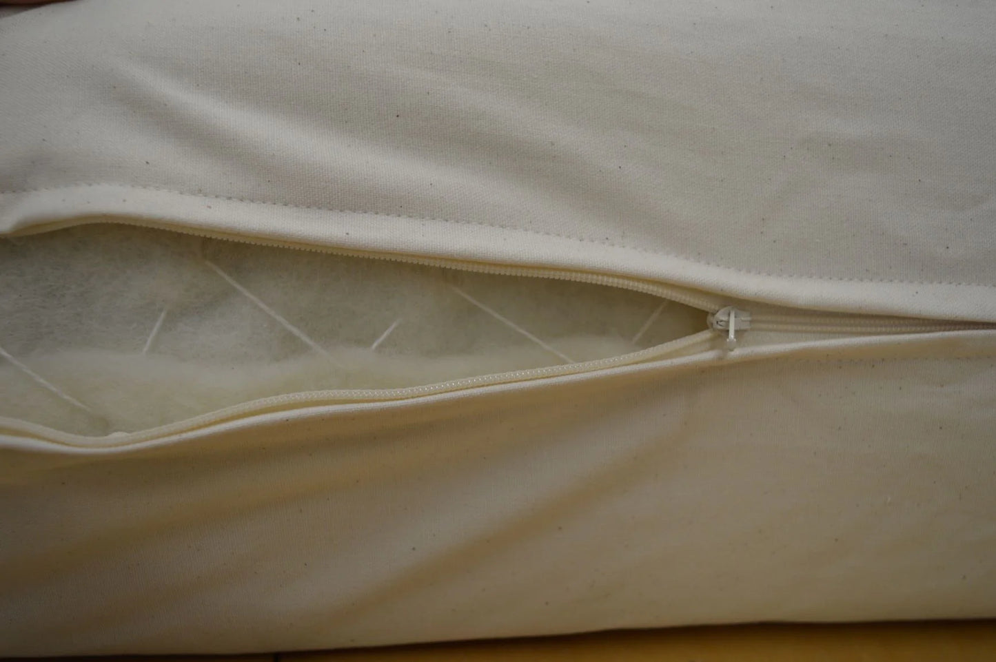 All natural, cushiony comfort from a 6" core of latex surrounded by a layer of durable Premium Eco Wool encased in organic cotton canvas. The canvas encasement is the perfect fit for a latex mattress, durable and soft to the touch. The result is a firm and supportive base layer (ILD rating of 28), perfect for a restful night's sleep. Wool's natural fire retardant properties mean no chemicals in this mattress.
