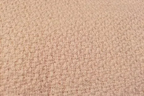 Crafted from GOTS certified organic cotton, the Crepe Weave Blanket by Organics and More offers timeless appeal with its simple yet elegant design. Never dyed or treated, this blanket provides a healthy and attractive bedding option. Lightweight and versatile, it’s ideal for both cool summer nights and winter layering. Skillfully constructed with hemmed edges, it withstands repeated washes while maintaining its quality. Available in a natural ivory color, this blanket exudes understated beauty and eco-frien