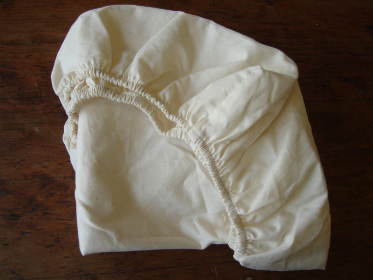The perfect addition to keep baby sleeping comfy, safe, and sound. Protect your bassinet mattress with our handmade fitted sheet. Organic cotton sateen with cotton elastic sewn in all around the edges for a snug, secure fit. Machine washable and easy to care for. Intended for use with mattresses measuring 18" x 35" x 2.5".