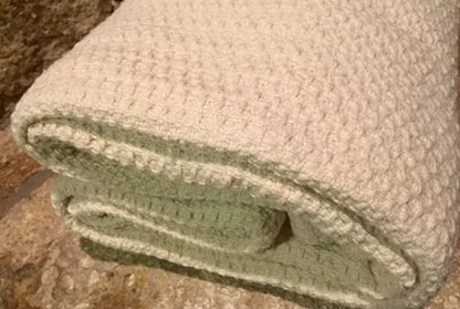 Experience year-round comfort with our Organic Waffle Weave Blanket, featuring a soft, lightweight design for cozy versatility. Crafted from GOTS certified organic cotton, this blanket offers both style and sustainability. Its loose waffle weave provides enhanced flexibility and breathability, perfect for all seasons. Whether draped over your bed or used as a stylish throw, its natural ivory color and hemmed edges add a touch of elegance to any space. Plus, it’s conveniently machine washable for easy care.