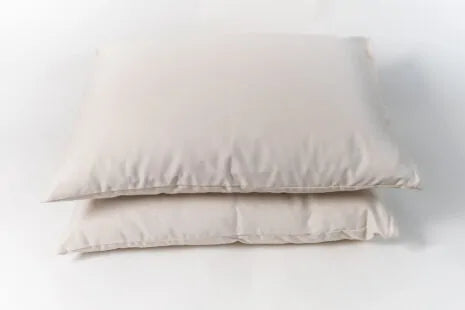 This pillow is made from certified organic cotton batting from the Texas Organic Growers Marketing Co-op. It is covered in organic cotton sateen. This is a great vegan pillow for those who do not want natural latex or wool. This is a firmer feeling pillow. Comes with a zipper so you can add or remove filling.