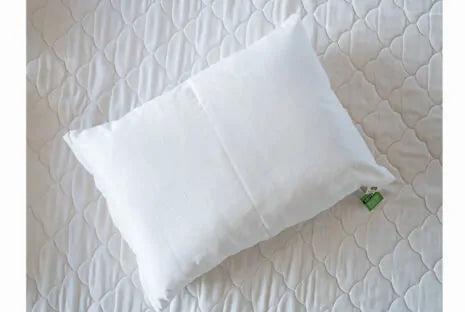 This pillow is made from certified organic cotton batting from the Texas Organic Growers Marketing Co-op. It is covered in organic cotton sateen. This is a great vegan pillow for those who do not want natural latex or wool. This is a firmer feeling pillow. Comes with a zipper so you can add or remove filling.