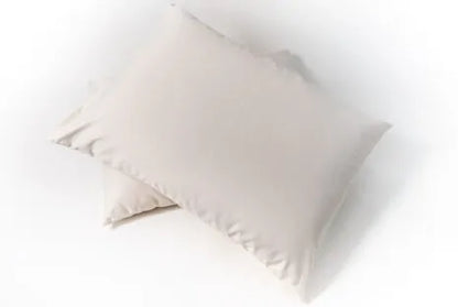 This pillow is made from certified organic cotton batting from the Texas Organic Growers Marketing Co-op. It is covered in organic cotton sateen. This is a great vegan pillow for those who do not want natural latex or wool. This is a firmer feeling pillow. Comes with a zipper so you can add or remove filling.