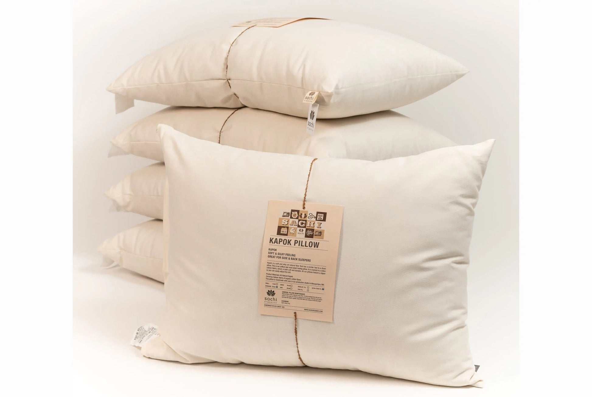 This pillow is made from soft silky kapok covered in organic cotton sateen. Kapok is a silky fiber, and feels much like milkweed or down. It is harvested from the seed pods of a kapok tree (the tree is never cut down). This natural pillow will compress with use but can be placed dry in a hot dryer for 10 minutes to help plump the pillow. This is our softest feeling pillow. Comes with a zipper so you can add or remove filling.