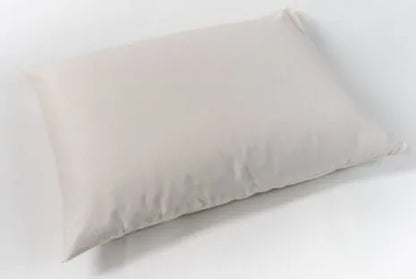 This pillow is made from soft silky kapok covered in organic cotton sateen. Kapok is a silky fiber, and feels much like milkweed or down. It is harvested from the seed pods of a kapok tree (the tree is never cut down). This natural pillow will compress with use but can be placed dry in a hot dryer for 10 minutes to help plump the pillow. This is our softest feeling pillow. Comes with a zipper so you can add or remove filling.